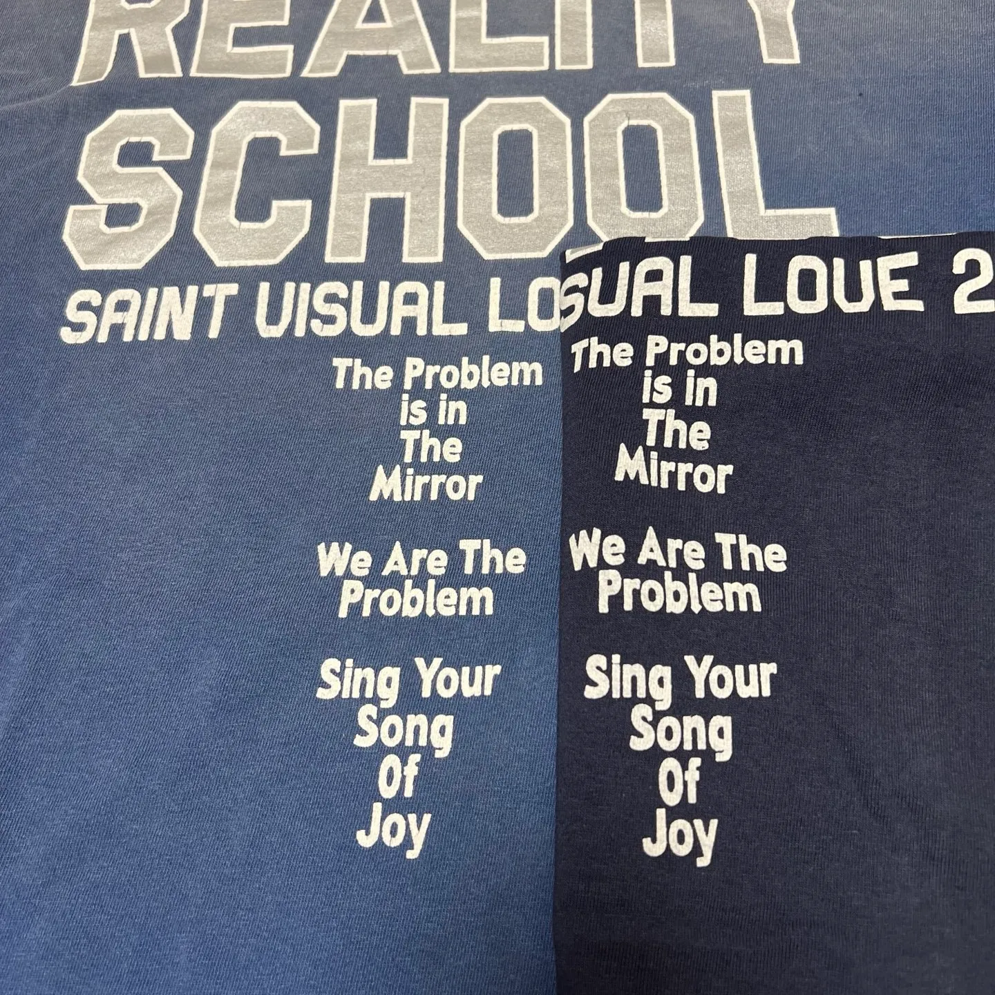 Printing proofing SAINT Mxxxxxx REALITY SCHOOL SS_TEE/NVY Slogan distressed short-sleeves Washed blue S-XL Garment dyeing Ma Liu fading Super complex shearing and destruction treatment Correct version Cylindrical fabric Customized original consistent main mark/wash mark Original consistent silver powder printing Distressed treatment